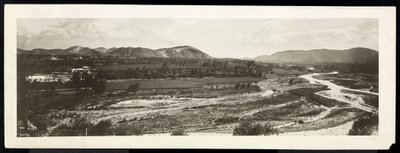 Panoramic view of a rural scene, presumably on or near the Panama Canal with snowcapped mountains beyond by Byron Company